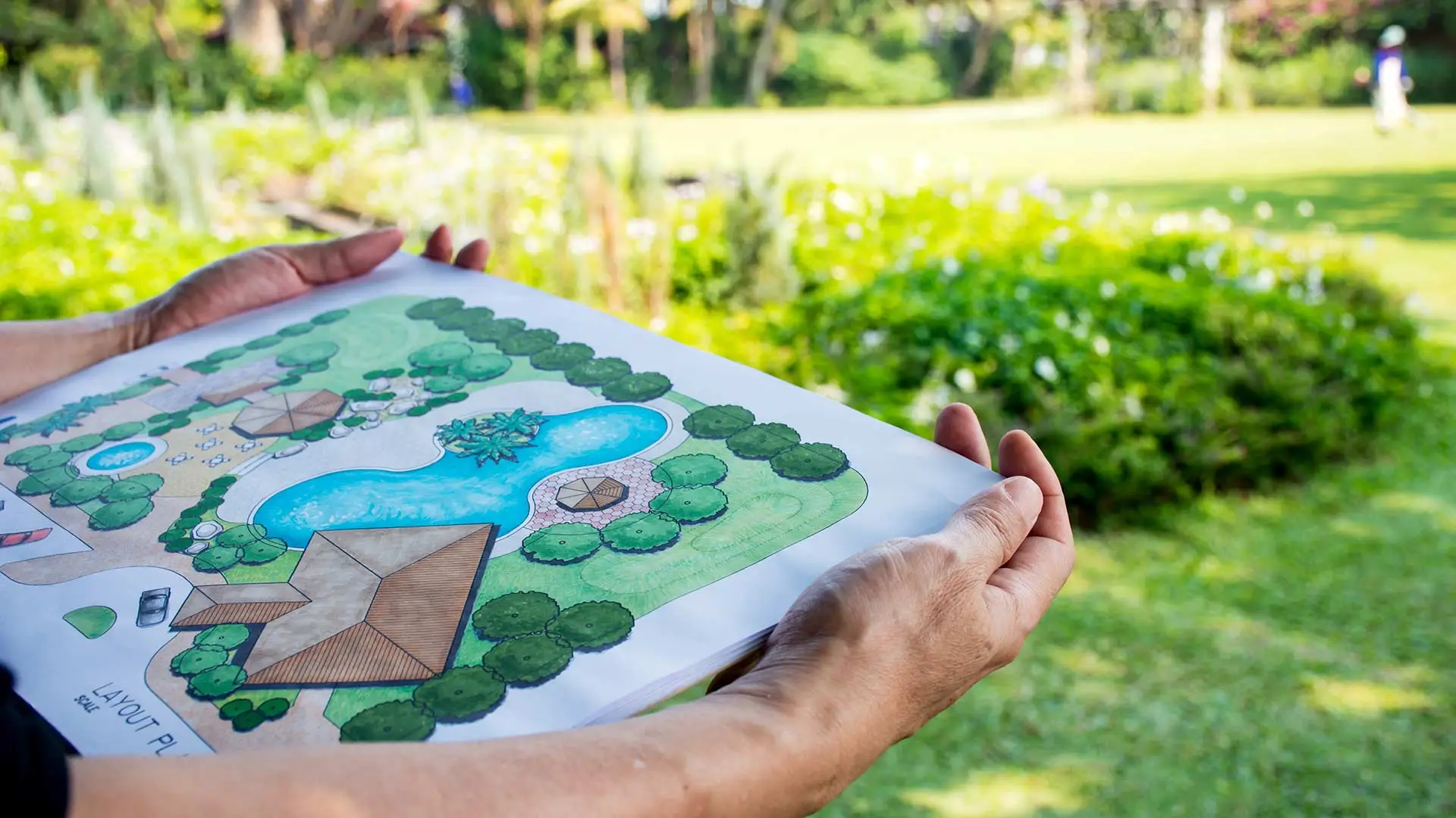 2D landscape design render held by a landscape architect at a property in Rancho Santa Fe, CA.