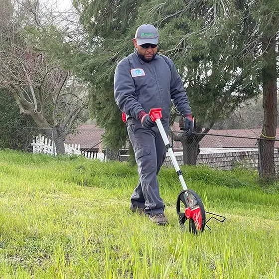 MSE Landscape Professionals worker using equipment on a property near Carlsbad, CA.
