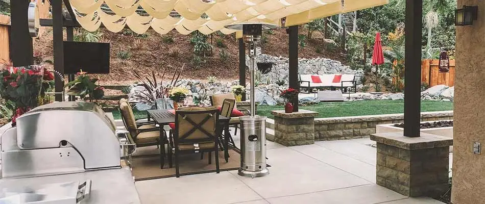 Outdoor kitchen living area with a pergola in La Jolla, CA.